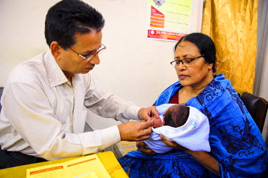Naima Akter (60) with her grandson (Arom Rahim, 24 days old) who has come for a vaccination at Dhaka Expanded Program on Immunisation (EPI) centre. The pneumococcal vaccine (PCV), which protects again...