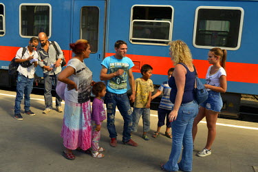 A group of undocumented Afghan migrants arrive by train, from the southern Hungarian border town of Szeged, at Budapest's Nyugati railway station where the group is met on the platform by some well-in...