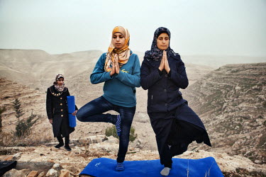 Hayat (left) teaches yoga to the residents of her village Zataara on the outskirts of Bethlehem in the West Bank. The women are increasing in number each week.