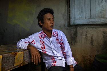 San Oo, 35, who was trafficked into Thailand from Myanmar and sold to a fishing boat on which he was forced to work at sea for two years and six months sits in a restaurant in Ranong. During his time...