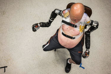 Les Baugh wears the Modular Prosthetic Limbs at Johns Hopkins Applied Physics Lab in Maryland. Baugh lost both his arms at the shoulder in a freak electrical accident 40 years ago. Since then, he has...
