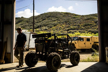 Engineers of the Unmanned Systems Group at Spawar, or Space and Naval Warfare Systems Command, a research and operations arm of the Navy, troubleshoot an autonomous vehicle called RaDer. The group is...