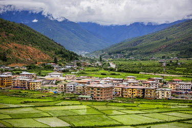 New housing developments in Paro Valley built on former paddy fields. Traditional farming land is being built over as people move to urban centres.
