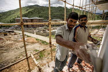 Indian migrant workers working on a construction site. Most manual work in Bhutan is carried out by Indian migrant workers. To curb unemployment levels, however, the government is trying to increase t...