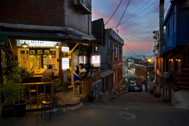 Customers sit outside a small restaurant on Usadan-ro No. 10 in the Itaewon and Hannan neighbourhoods.
