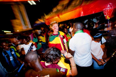 Football fans at a roadside bar in Accra soon after Ghana progressed to the next round of the 2010 FIFA World Cup following their match with Germany on 23 June 2010.