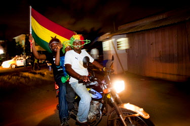 Jubilant football fans in Accra celebrate Ghana's progression to the next round of the FIFA World Cup in spite of their 1 - 0 loss to Germany on 23 June 2010.