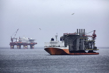 A floatel (left) used accommodate staff working in the UK's deep-sea drilling fields, and drilling rig are moved toward the Atlantic frontier and the UK's deep-sea drilling fields.