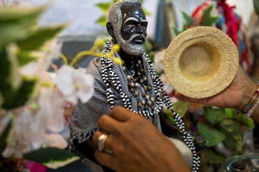 At a private residence Umbanda practitioners perform a ceremony in honour of the Brazilian saint, Sao Sebastiao, (whose's Umbanda African deity name is Oxossi, the son of Yemenja). Mara Agar places be...