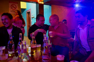 Chinese people from the Coca Codo Sinclair hydroelectric project (CCS) project drink beer at a brothel that did not exist before the CCS began. San Luis is a town that has grown rapidly since construc...