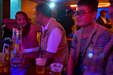 Chinese people from the Coca Codo Sinclair hydroelectric project (CCS) project drink beer at a brothel that did not exist before the CCS began. San Luis is a town that has grown rapidly since construc...