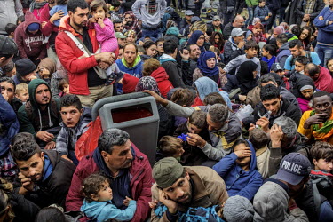 A large crowd of refugees and migrants is seen in the Austrian village of Nickelsdorf where they have gathered after crossing the border from Hungary. They are waiting to get trains to Vienna and poss...