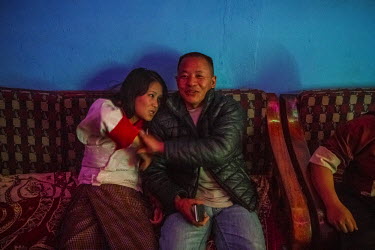 A drunk customer of 'Tashi Tagay drayang' grabs a female dancer who works at the club. Drayangs are clubs where girls work dancing for male clients. Most of the girls come from poor rural families and...