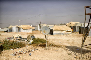 A television satellite dish outside a home at Zaatari Refugee Camp. Many of the camp’s residents dream of a better life in Europe, and during the second half of 2015 the number of people leaving the...