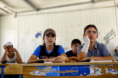 Youths in a class in a school at Zaatari Refugee Camp. Many of the camp’s residents dream of a better life in Europe, and during the second half of 2015 the number of people leaving the camp, to try...