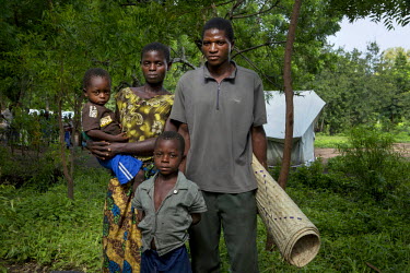 Bestwick Simbi, 31, with his wife and two children in Khulubvi Camp set up following devasting floods in early 2015 that affected half of Malawi and forced around 250,000 people from their homes.