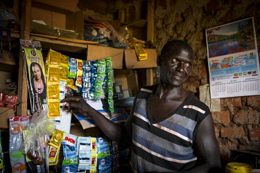 Nasa Oyoo Otii, 47 years old, in his small shop. In 2000, he fled Lord's Resistance Army insurgency with his wife and children to become IDPs in Masindi (approx. 235kms away). He returned to Pader in...