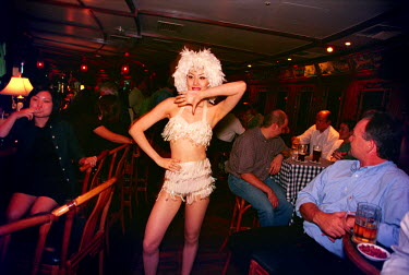 A dancer at the famous Long Bar in the Ritz Hotel.