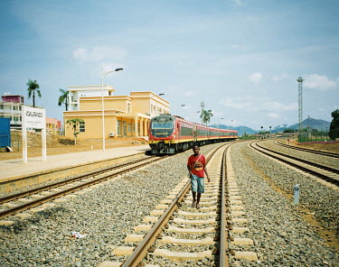 A young man walks along a railway track at N'dalatando railway station, halfway along the 424 km long newly refurbished railway from Luanda, the capital, and Malanje. The newly relaunched line, financ...