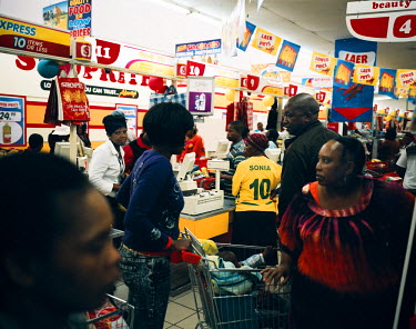 A busy scene at a Shoprite supermarket on pay day. A few days earlier the aisles had been empty but on payday people stock up on essentials in large numbers.
