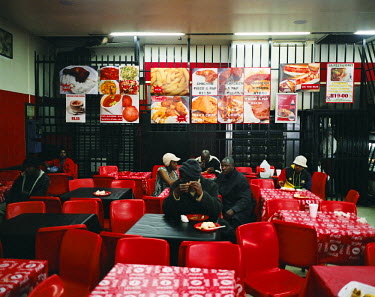 The BA Restaurant near a bus station in the Central Business District. Most of the clientele here are working class people waiting for a connection for buses to the outer suburbs of town. During the A...