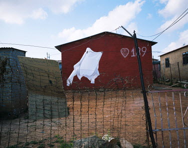 A shirt hangs on a washing line in a yard in Freedom Park, an older Reconstruction and Development Program (RDP) insouthwestern Johannesburg. The RDPs were introduced and implemented by the first post...
