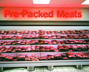 The large refigerated meat section in the ^Pick n Pay^ shopping centre in Melville, a middle class suburb of Johannesburg where, unusually, black and white middle class families live side by side.
