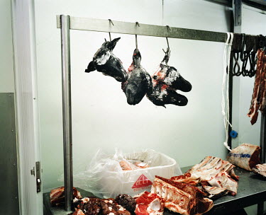 Three cow heads hang on hooks in a butcher shop in downtown Johannesburg. During the Apartheid years, the Central Business District went from being a busy commercial centre where only white people wer...