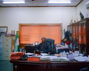 The manager of LAWMA, the waste management public authority in Lagos, in his office. LAWMA supplied the equipment and land that enabled Wecyclers (a waste recycling startup) to develop. They wish to u...
