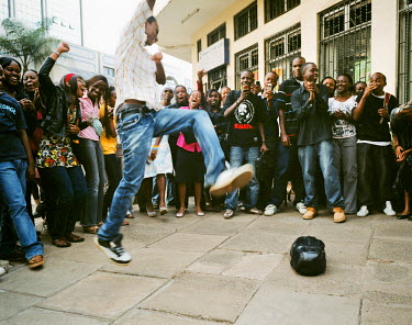 In Nairobi's city centre, a high-school student performs dance moves in front of his friends during the shooting of an episode of television programme 'So you think you can dance!'. The series came fr...
