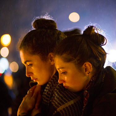 Two young women pay their respects to those killed during the 13 November terrorist attacks in Paris at an impromtu memorial on the Place de la Republique. On 13 November 2015, coordinated attacks at...