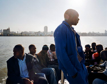 Passengers on a morning ferry from the commuter town of Matola to Maputo.