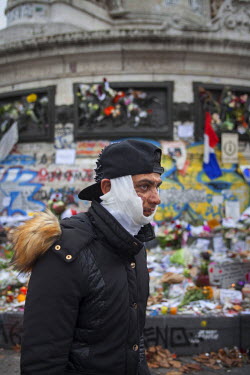 A young man at Place de la Republique, one of the many impromptu memorial sites created by the public as Paris struggles to come to terms with the events of 13 November 2015.On 13 November 2015, coord...