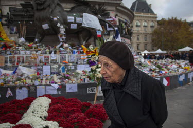 An elderly woman at Place de la Republique, one of the many impromptu memorial sites created by the public as Paris struggles to come to terms with the events of 13 November 2015. On 13 November 2015,...