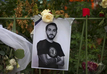 A photograph of Cedric Gomet, 30, who died at the Bataclan, at one of the many impromptu memorial sites created by the public at the sites of the atrocities and in the Place de la Republique as Paris...