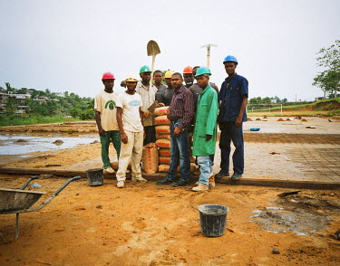 Construction site supervisor Frank, who recently resumed studies for an MBA, and his team at a hospital building site.