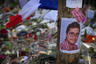 A photograph of Romain Dunet, 25, who died at the Bataclan, at one of the many impromptu memorial sites created by the public at the sites of the atrocities and in the Place de la Republique as Paris...