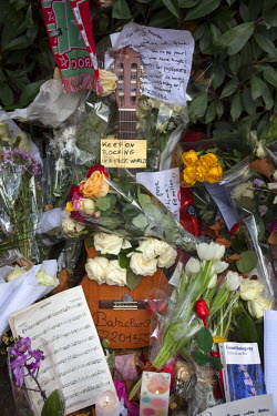 Flowers and a guitar at one of the many impromptu memorial sites created by the public at the sites of the atrocities and in the Place de la Republique as Paris struggles to come to terms with the eve...