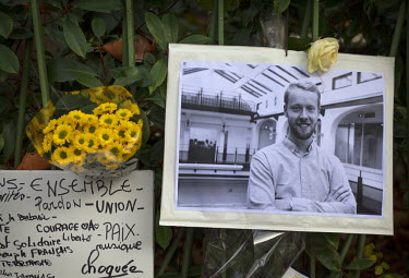 A photograph of Francois-Xavier Prevost, 29, who died at the Bataclan, at one of the many impromptu memorial sites created by the public at the sites of the atrocities and in the Place de la Republiqu...