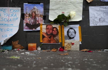 Photographs of people killed during the 13 November terrorist attacks placed at one of the many impromptu memorial sites created by the public at the sites of the atrocities and in the Place de la Rep...