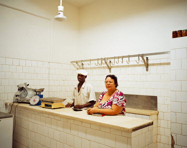 A butcher and her employee at the time of closing. In small towns, businesses are still often held by Indian or mestizos.