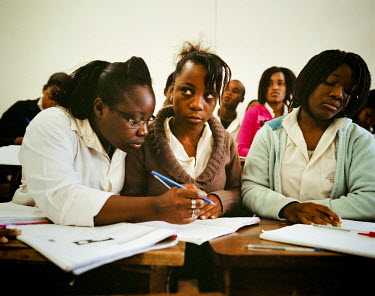 Girls studying in class at a private school on the outskirts of Maputo. Since the end of the civil war the number of private schools and universities have grown.