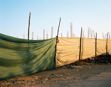 A hoarding hides construction work in Chokwe, a small provincial town near the border with South Africa, which is experiencing a period of rapid growth.