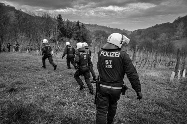 Police deployed to try and stop a clash between of a pro-refugee leftist group of marchers and an opposing rightist anti-immigration group. A game of cat and mouse ensued through the steep vineyards o...