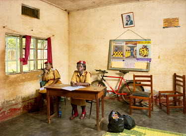 Cadet Assistant Superintendent of Prisons Geraldine Najjuma Prossy (L) and wardress Beatrice Ipali (R) in the visitor's room at Luzira Remand Prison. The facility was built to accommodate 600 inmates...