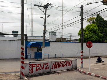 La Modelo high security prison in Bogota. Built in 1957 with a capacity for 5,810 inmates, in August 2015 it held 7,567 prisoners. A 'Happy Christmas' slogan is painted on sign beside the road, in Aug...