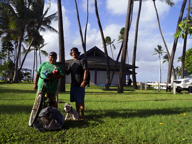 Be Jay Rafanan, 36 and Davey G Balinbin, 36. Both are ‘Maui boys’ born on the island. The sleep on the beach at Hoaloha Park next to the canoe club. They survive by recyling plastic bottle and can...