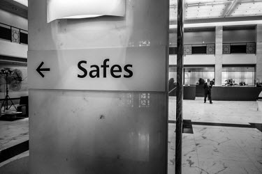 A sign inside an UBS building points the way to the safes.