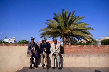 Three elderly men sit and talk on the palm-lined Independence Avenue. The hugely proud old men of the Eritrean capital call themselves Asmarinos. In their youth, under Italian colonial rule in the 193...