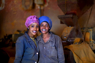 Women Berbere (spice) grinders in the Medeber metalwork market. This huge market is the centre of Asmara's recycling industry.